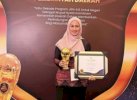 Bupati Lutra Indah Putri Terima Penghargaan Universal Health Coverage
