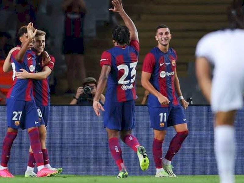 Pemain  Barca merayakan gol ke gawang Tottenham. (int) 
