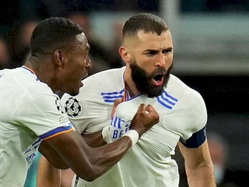Karim Benzema merayakan gol usai membobol gawang PSG.  Real Madrid menang 3-1. (int) 
