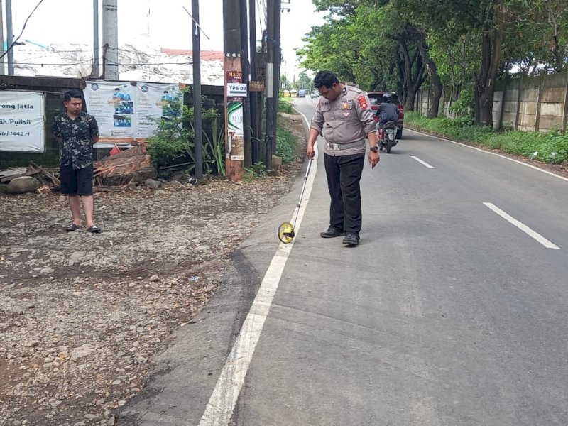Pihak kepolisian saat mendatangi lokasi kejadian/Ist